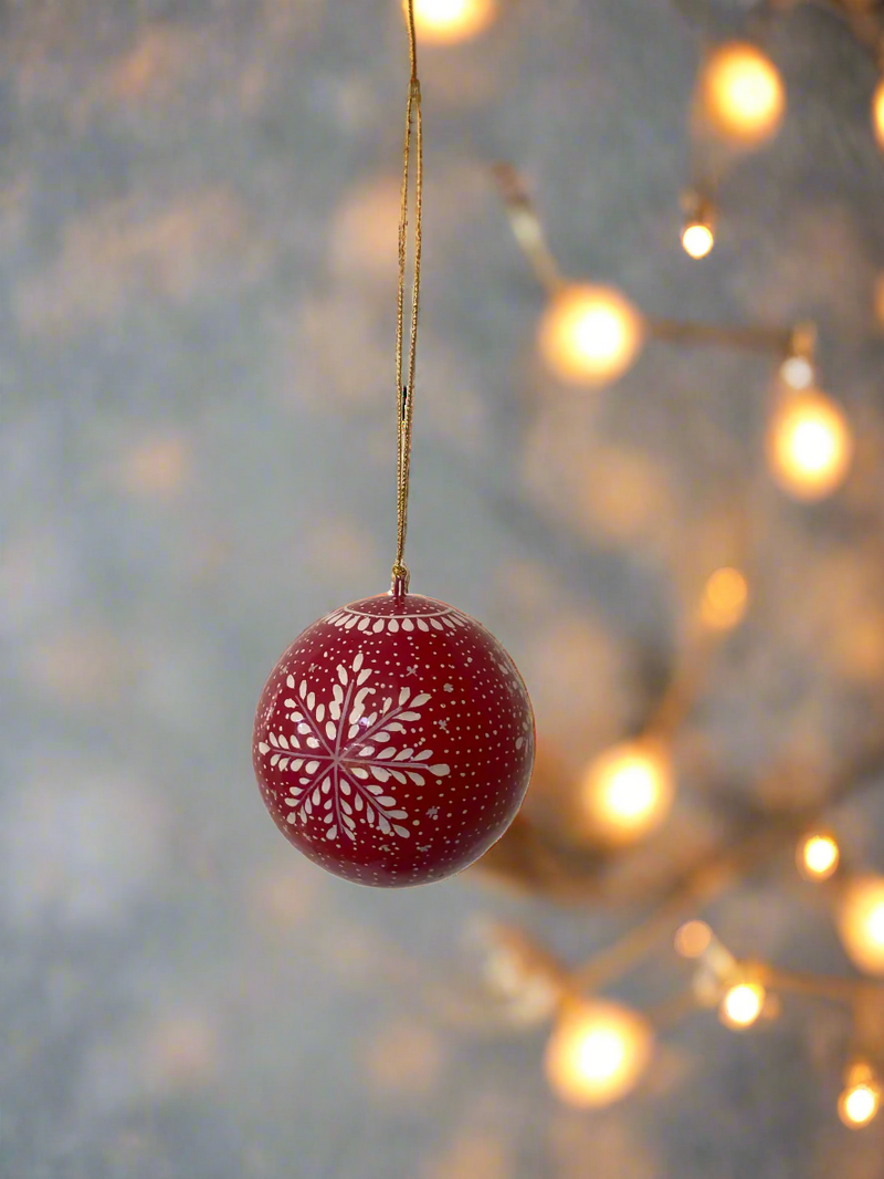 red snowflake papier-mache bauble