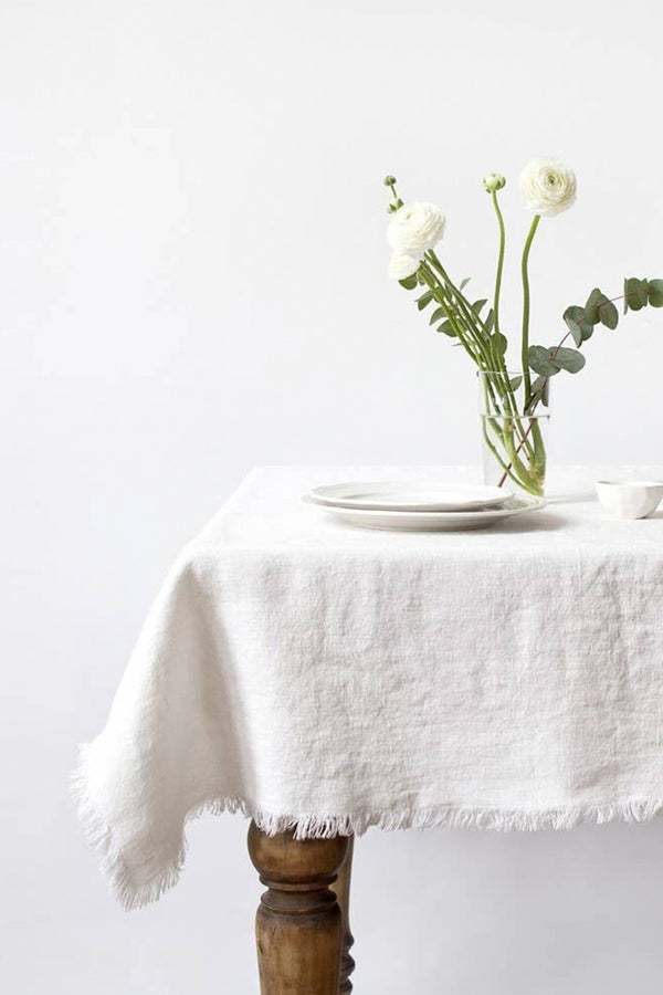 white linen tablecloth with fringes