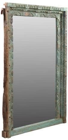 large heavily carved indian mirror