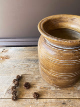 ceramic brown vessel with grooves